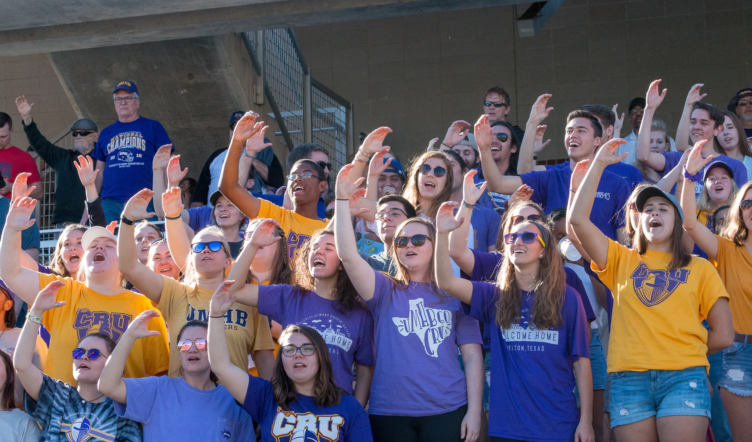 Group of UMHB students cheering at a game